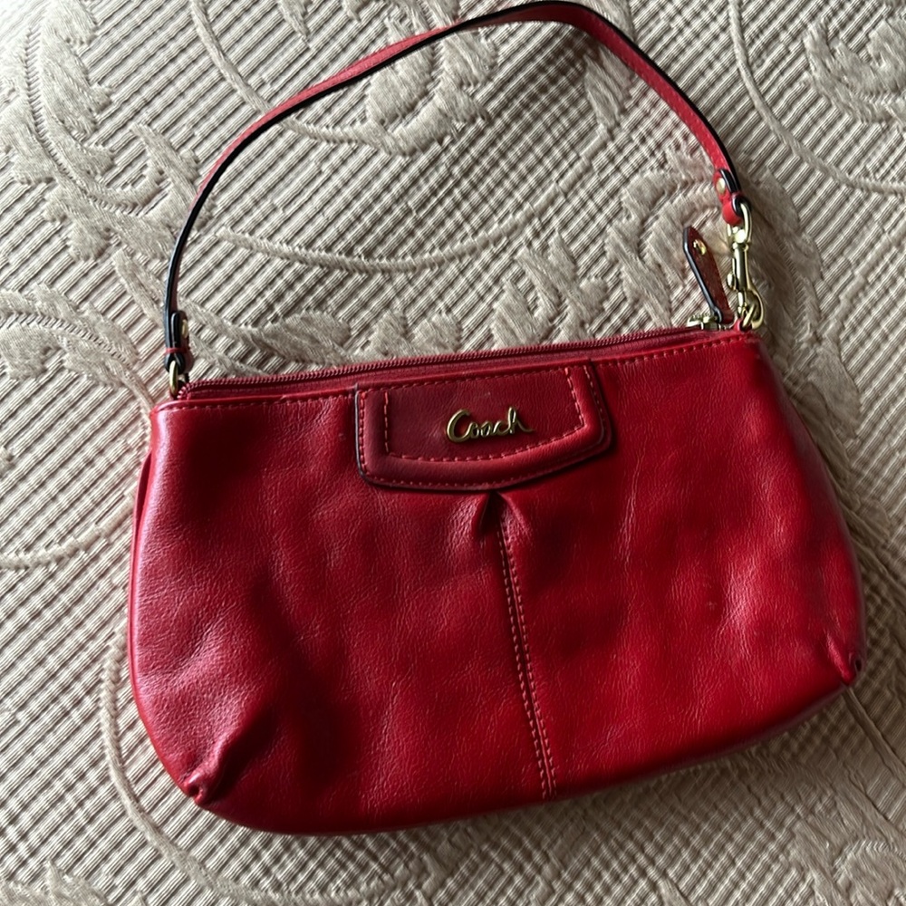 Coach purse.  Red leather.  Perfect condition.  Small clutch or over wrist bag.